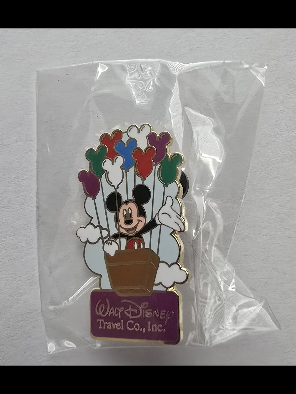Disney Gold-Tone Mickey Silhouette Travel Co  Enamel Pin